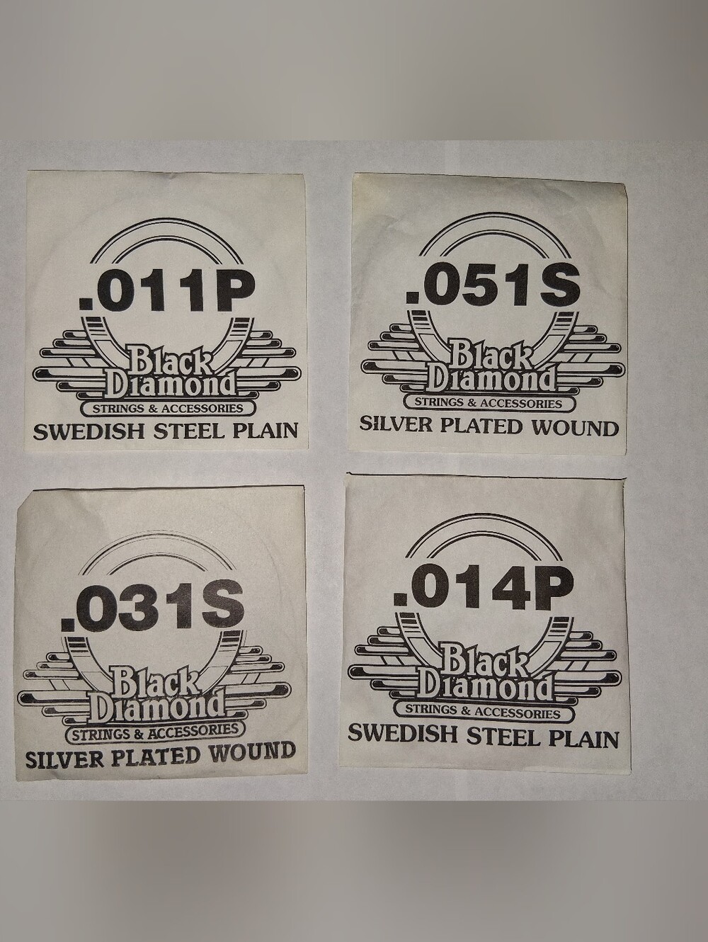Black Diamond Guitar Strings 4 Pack Silver Plated Swedish Steel Plain